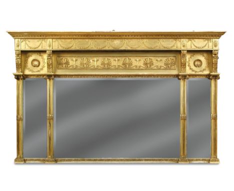 A Regency style gilt framed overmantle mirror, circa 1900, the triple bevelled plates bordered by anthemion and neoclassical 