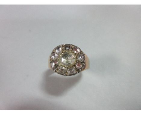 A 19th century diamond ring, the ring head, possibly originally a Georgian button, set to the centre with an oval rose cut di