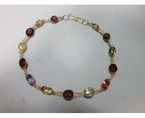 A multi gemset bracelet, each oval or round cut stone of rainbow hues and including amethyst, citrine, garnet and spinel, spe