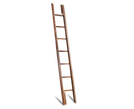 A leather and brass nailed pole ladder, 258cm (101in)  The confition is considered to be good