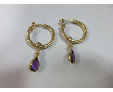 A pair of 18ct gold ear hoops with removable amethyst pendant drops, the hollow hoops with reeded terminations, hallmarked Sh