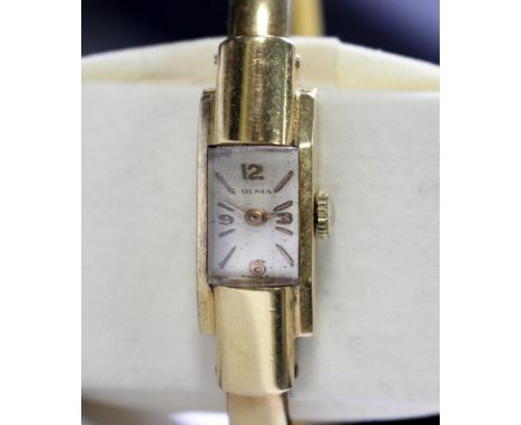 Olma - a lady's 18ct gold cased wristwatch, the oblong silvered dial signed 'Olma' with gold coloured Arabic and baton numera