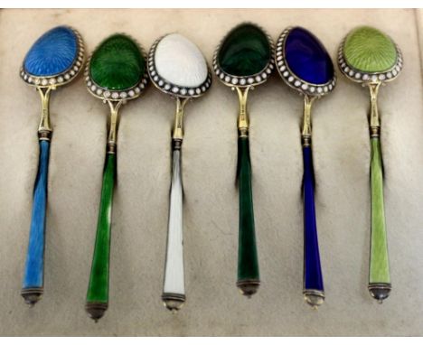 A set of six German silver gilt and enamel coffee spoons, retailed by and probably made by Eduard Foehr, Stuttgart circa 1920