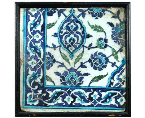 An Islamic pottery tile, probably 16th century Syrian, painted in blue, turquoise and green with buds, flowers and leaves on 
