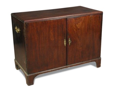 A George II mahogany cabinet, with concealed internal drawer and shaped shelf, side mounted brass handles, on square bracket 