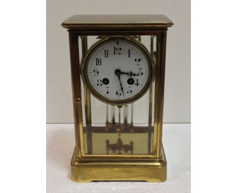 A French four-glass mantel clock, c.1900, the white painted dial with Arabic numerals and gong striking drum movement, with m