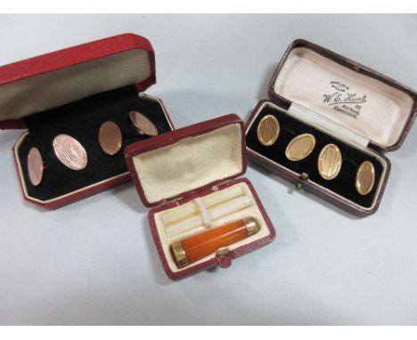 A small collection of gentleman's requisites, firstly a pair of oval double-ended engine-turned hallmarked 9ct gold cufflinks
