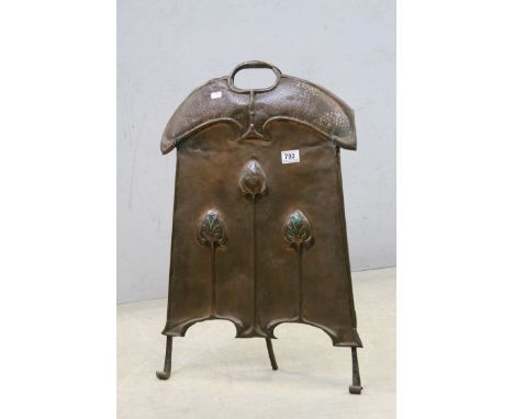An early 20th century art Nouveau copper fire screen with enamel inlay .