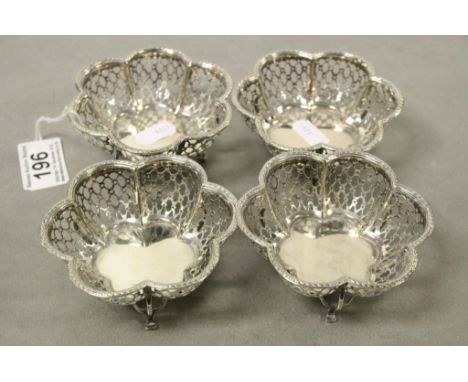 Set of four Hallmarked Silver Bonbon type Dishes on tripod feet with Pierced decoration to the floral design, Birmingham 1911