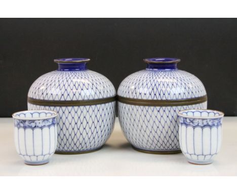 Pair of blue and white lidded Japanese pots, together with similar ceramic cups 