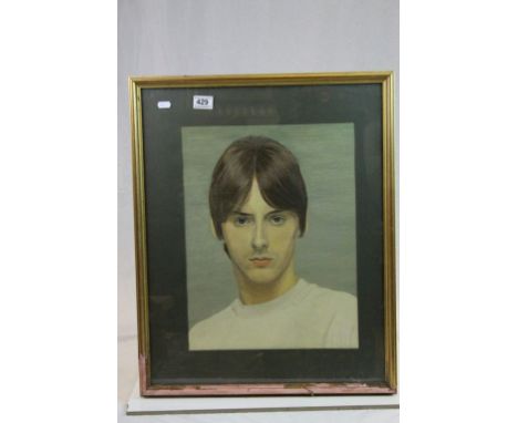 A framed portrait of Paul Weller.