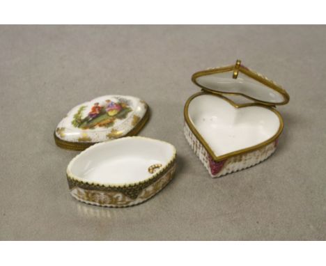 Two vintage hand painted ceramic Trinket boxes, one heart shaped and both with Meissen crossed swords mark to base, heart box