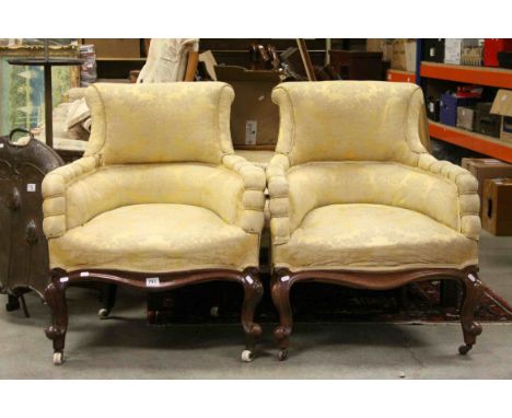 Pair of 19th century Mahogany Framed Tub Armchairs upholstered in matching yellow mustard fabric, raised on carved scrolling 