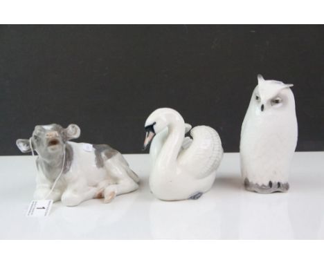 Three Royal Copenhagen ceramic Animals to include; Owl number 155, Cow numbered 082, Swan numbered 359