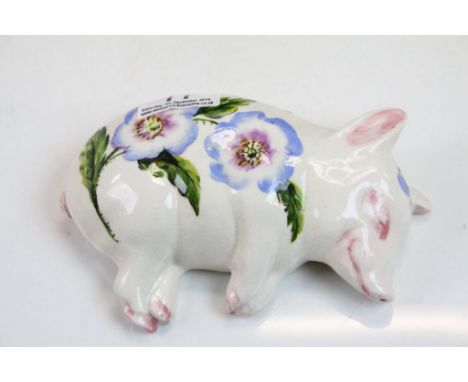 Wemyss ceramic model of a Pig lying on its side with hand painted Floral decoration, marked "Exon. 2517 B Adams". approx 15cm