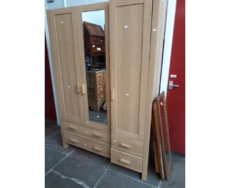 A MODERN LIGHT WOOD EFFECT WARDROBE