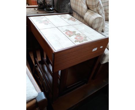 A TEAK AND TILE TOP NEST OF TABLES