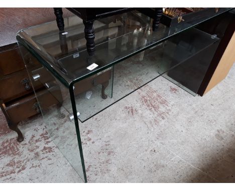 A MODERN GLASS CONSOLE TABLE