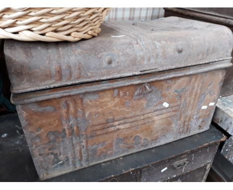 AN OLD METAL TRUNK