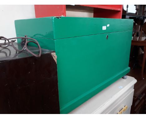 A PAINTED TRUNK ON CASTORS