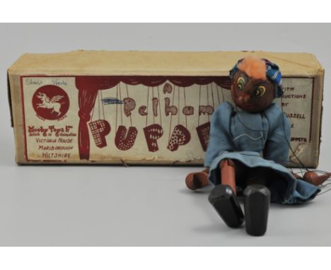 Pelham puppet, modeled as a black lady, boxed.