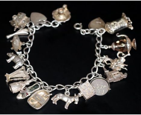 Silver Charm Bracelet Loaded With 17 Charms To Include Carriage Clock, Stone Set Tea Pot, Hinged Church, Spinning I Love You,