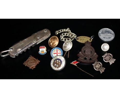 Small Mixed Lot Comprising A Swiis Army Knife, Military Badges, Dog Tag And Associated 