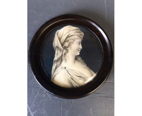 C19th Continental School, portrait miniature of a 'Lady' in profile, en grisaille