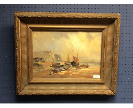 Gilt framed oil painting, Seascape with beached fishing boats and fisher folk on shoreline, 25x36cm