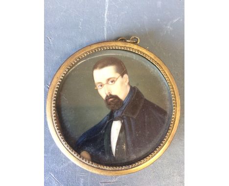 Portrait miniature of a 'Gentleman', head and shoulders, circular in a gilt frame