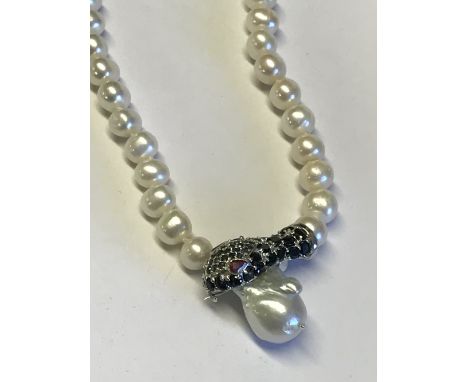 Unusual silver freshwater pearl necklace with snake clasp set with ruby eyes