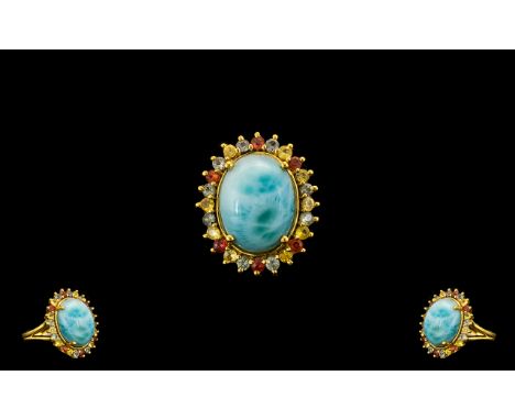 Larimar and Green, Yellow and Sunset Sapphire Ring, a 10ct cabochon of the natural, opaque, beautifully mottled sky blue lari