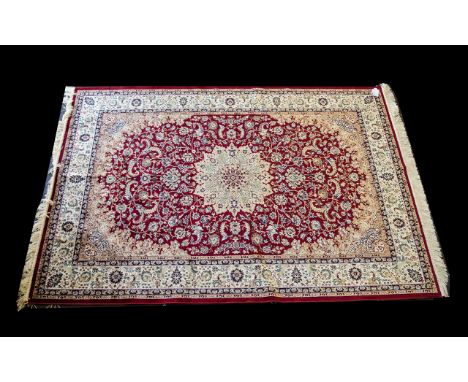 A Large Woven Silk Carpet Keshan rug with beige ground and red border traditional Middle Eastern floral and foliate border de