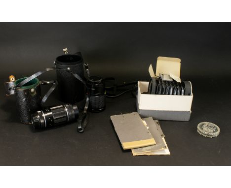 A Collection Of Camera Lenses To include Asahi 1114658, Sunagor no.K8401881, Boxed series V11 Slide Duplicator etc.