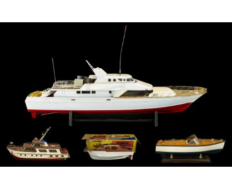 A Large Scratch Built Model Boat, partly completed, in the form of a large cruiser speedboat with wood effect deck and white 