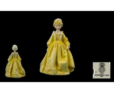 Royal Worcester Figure. 'Grandmother's Dress'. Pretty lady in a yellow dress and white bonnet. Design number RW3081. Height 1