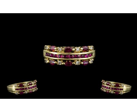 Ladies 9ct Gold Attractive Ruby and Diamond Set Dress Ring, Channel Setting. The Rubies of Excellent Colour with Diamond Spac