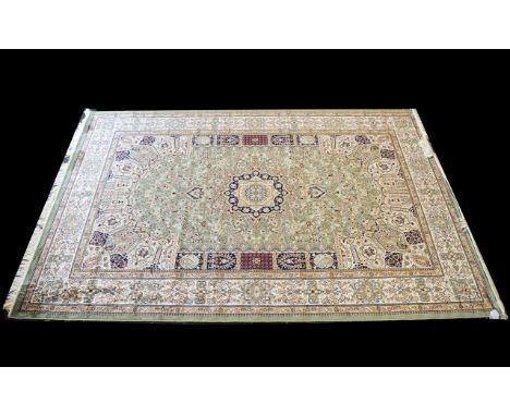 A Very Large Woven Silk Carpet Keshan rug with cream ground and green border with traditional floral and foliate detail with 