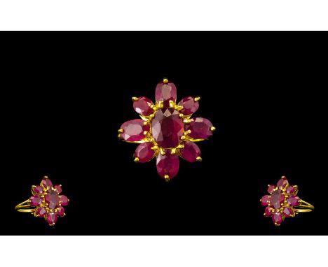 Ruby Flower Shape Ring, the centre oval cut ruby, of 3.75cts, surrounded by a further eight oval cut rubies, totalling 7cts, 
