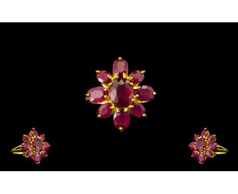 Ruby Flower Shape Ring, the centre oval cut ruby, of 3.75cts, surrounded by a further eight oval cut rubies, totalling 7cts, 