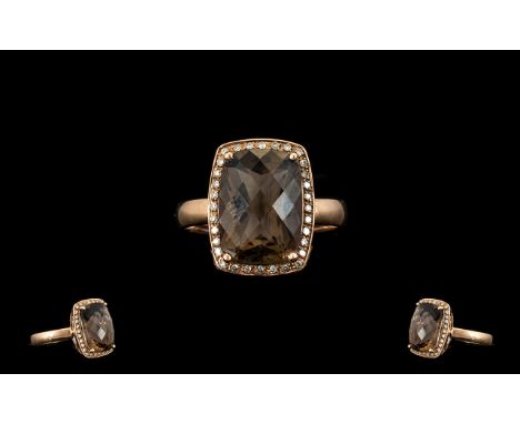 Ladies - 9ct Gold Attractive Topaz and Diamond Set Dress Ring, The Faceted Topaz of Good Colour. Est 6.00 cts. Ring Size - R.