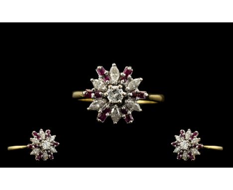 18ct Gold Diamond and Ruby Set Ladies Ring of starburst design. Marked 750-18ct. The marquise shaped diamonds are princess cu