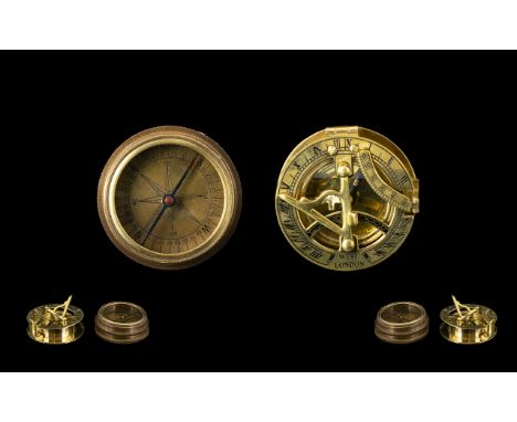 Brass West London Compass/Sundial Diameter 2½ Inches, Together With A Brass Cased Compass, Top And Inside Lid Engraved With T