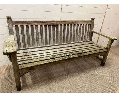 A garden wooden slatted teak bench, weathered (H91cm W188cm D70cm)