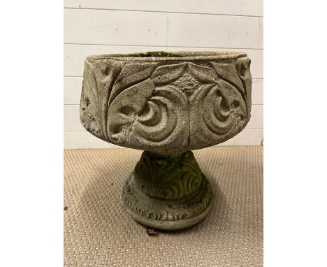 A garden planter on pedestal 