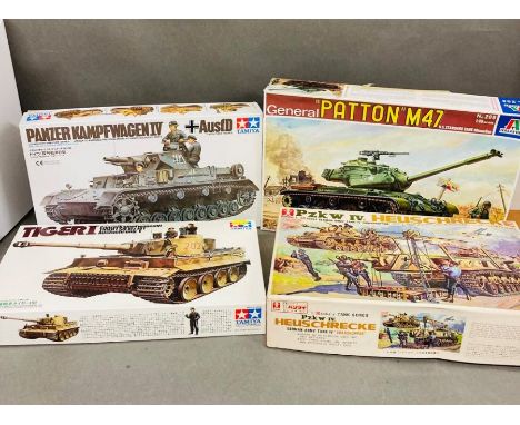 A selection of four model tanks, Pzk W-IV Heuschrecke, Tigeri Panzerkampfwagen VI Tiger Ausfuehrung, Panzer Kampfwagen IV and