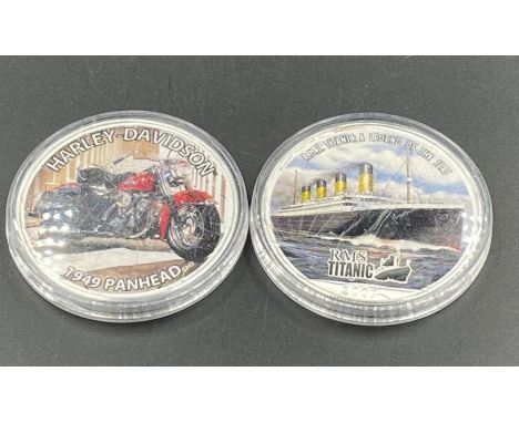 Two American 1 oz silver dollars celebrating Harley Davidson and Titanic