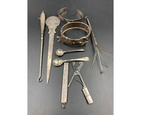 A selection of silver curios to include cocktail stirrer, button hook, bracelet etc