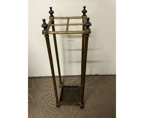 A brass umbrella or stick stand with four compartments 