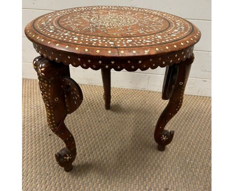 An inlaid Indian table with carved elephant trunk legs (H40cm Dia40cm)